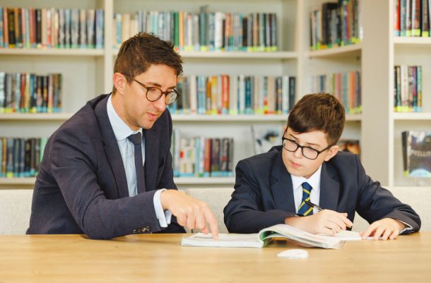 teacher and student in the library