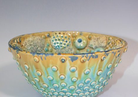 clay bowl with eyes