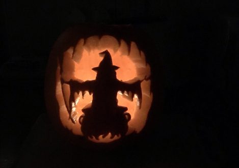 A witch carved into a pumpkin