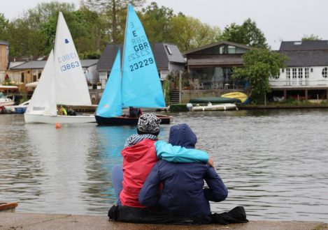 people sat by water