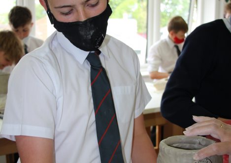 students in pottery class