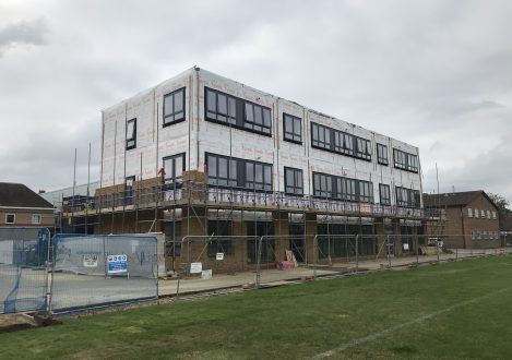 exterior of a school building being built