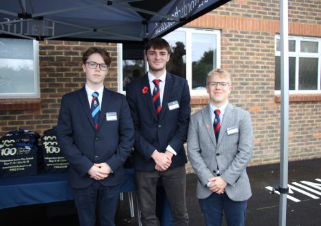 3 students at the tarpaulin cover