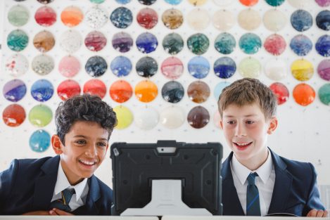 Students looking at an iPad