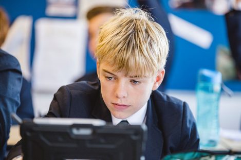 Student looking through an iPad