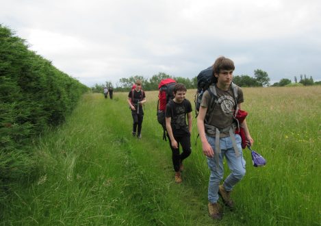 Students walking along a field