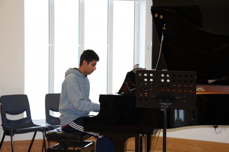 boy playing the piano