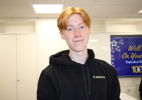 pupil in black hoodie smiling