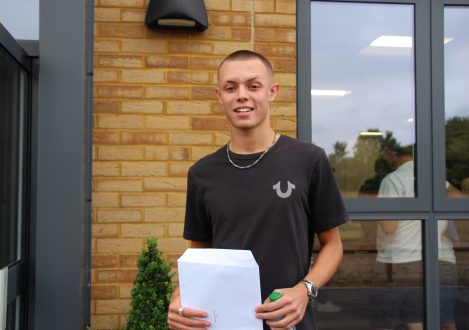 pupil holding an envelope