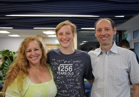 child smiling with his parents