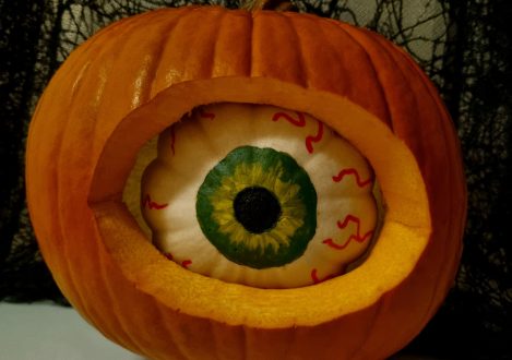 eyeball carved into a pumpkin