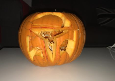 carved pumpkin with seeds