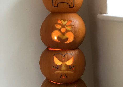 carved pumpkins stacked