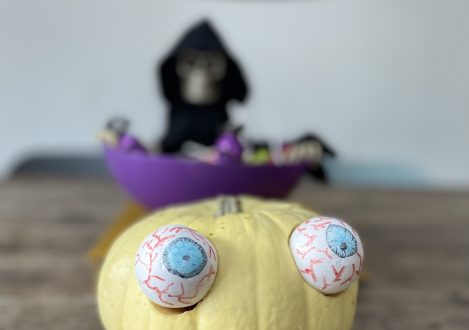 small yellow pumpkin with eyes