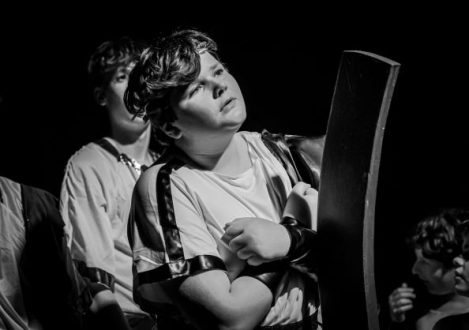 black and white photo of a boy in a costume for a play