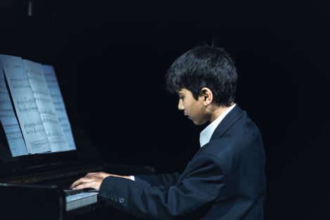 boy playing piano