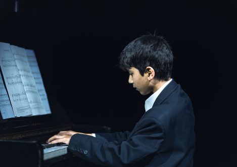 boy playing piano