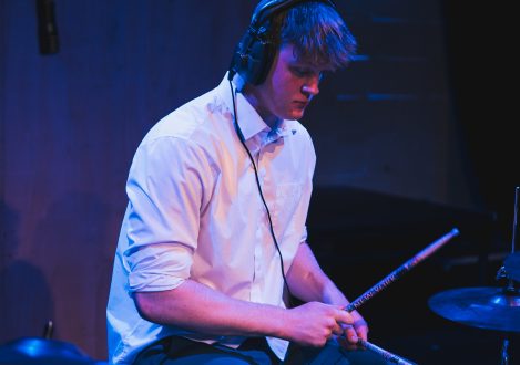 boy playing drums