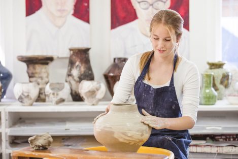 Student taking part in pottery