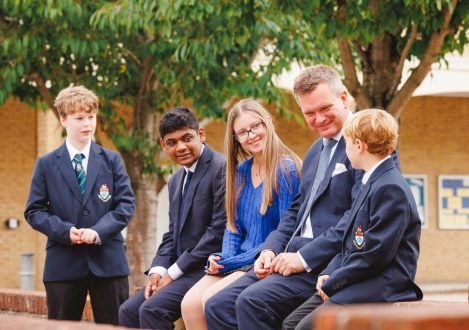 students talking around the teacher