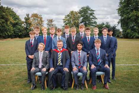 school boys sat and stood around outside