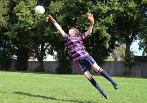 boy about to catch a football