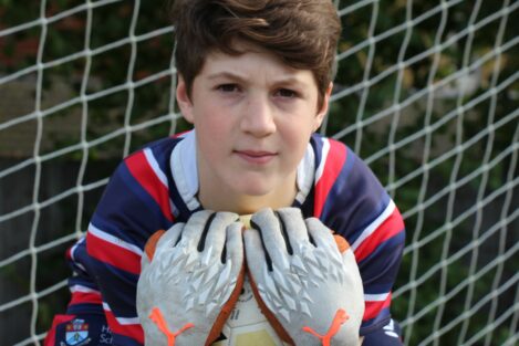 boy holding onto a ball