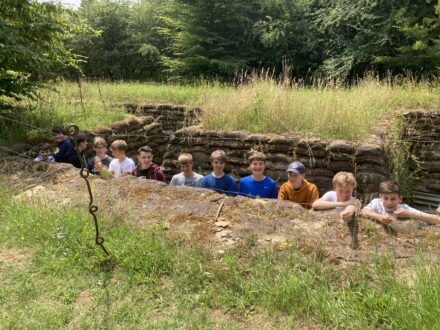 students in a trench