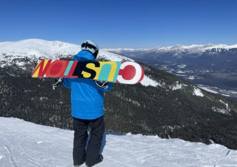 student with a snowboard