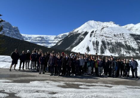 students behind a snowy mountain