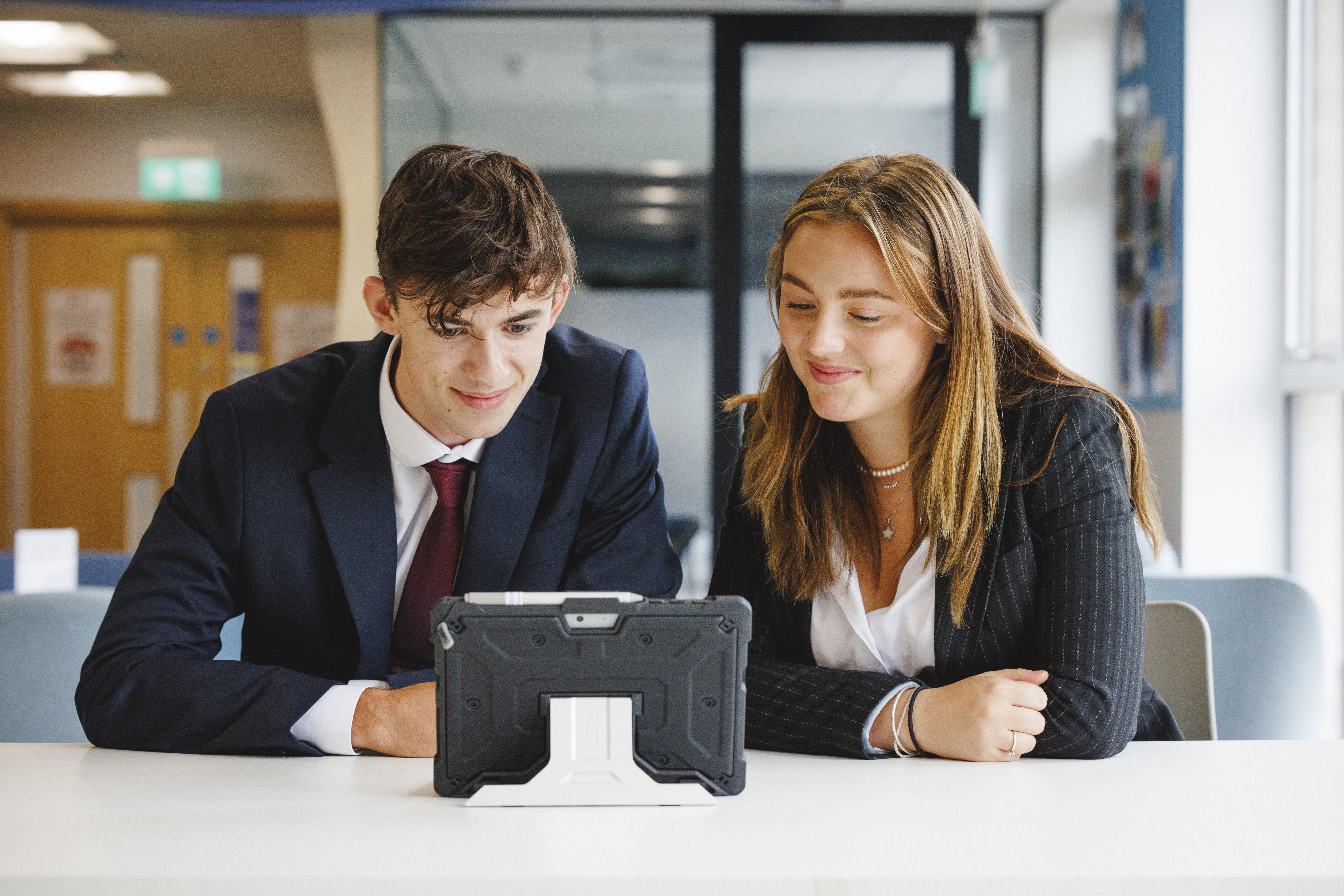 students looking at an ipad