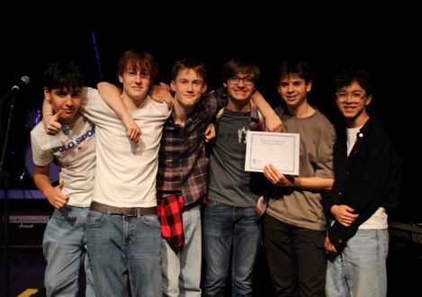 students holding a certificate