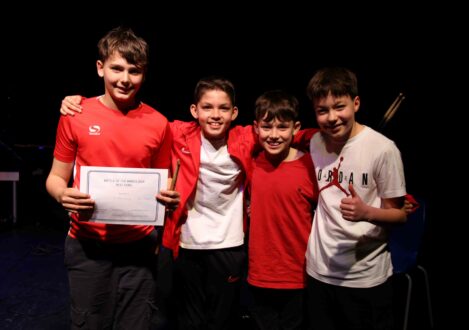 students holding a certificate