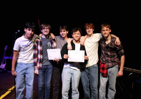 students holding a certificate
