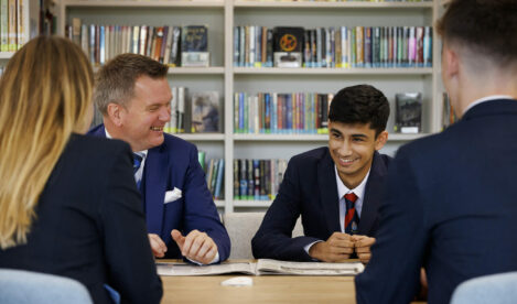 teachers laughing with a student