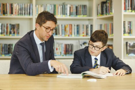 student and teacher working together