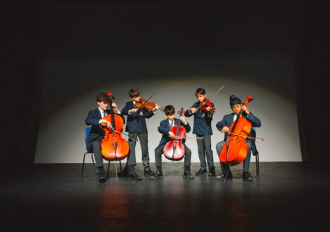 students playing cellos
